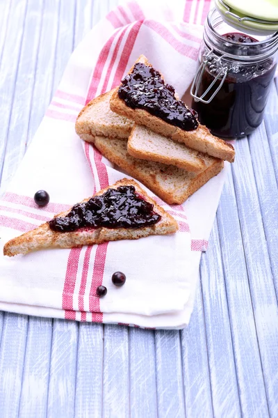 Delicious toast with jam on table close-up — Stock Photo, Image