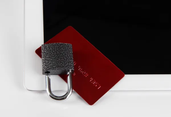 Credit card with lock and tablet close up — Stock Photo, Image