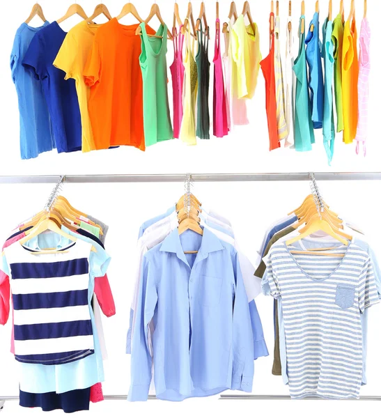 Different clothes on hangers, on gray background — Stock Photo, Image