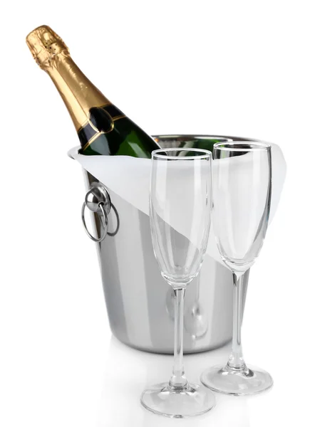 Bottle of champagne in pail and empty glasses, isolated on white — Stock Photo, Image