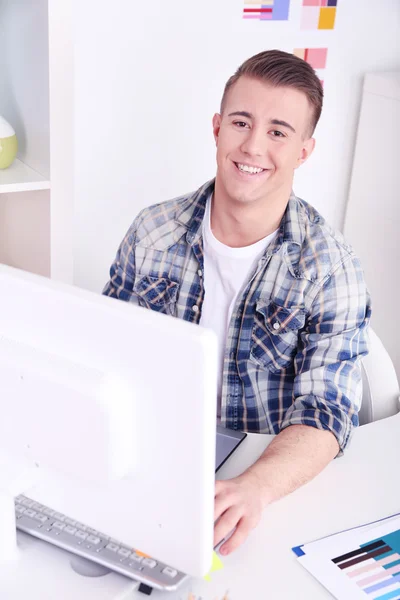 Young creative designer working at office — Stock Photo, Image