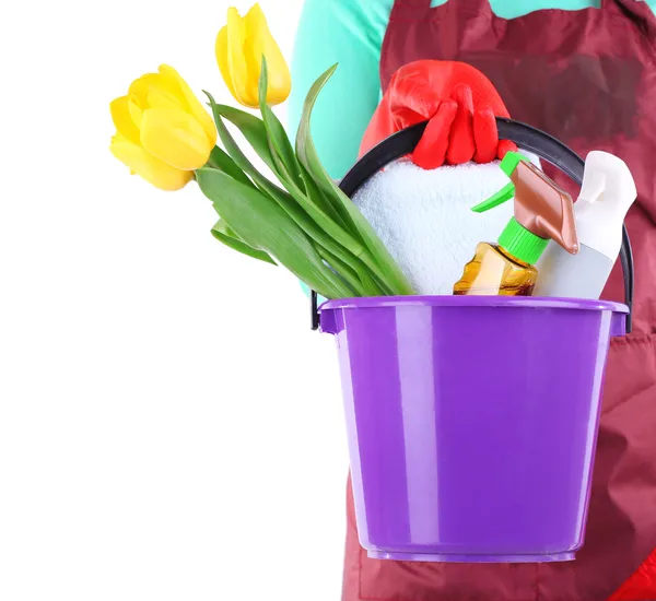 Housewife holding bucket with cleaning equipment. Conceptual photo of spring cleaning. Isolated on white — Stock Photo, Image