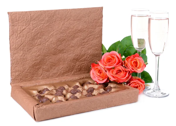 Delicious chocolates in box with flowers isolated on white — Stock Photo, Image