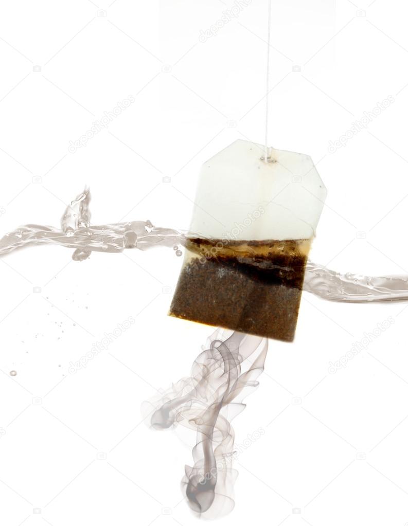Tea bag dipped in hot water — Stock Photo © belchonock 42325829