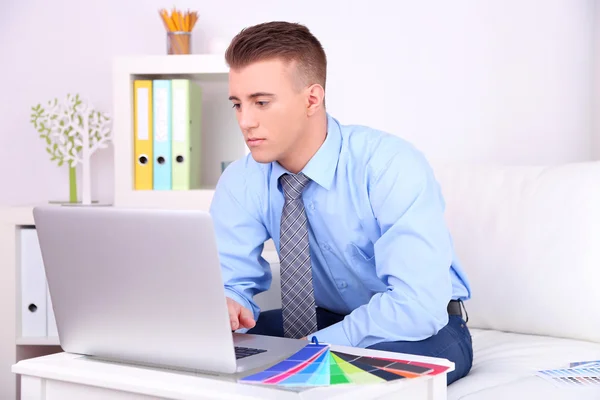 Young creative designer working at home — Stock Photo, Image