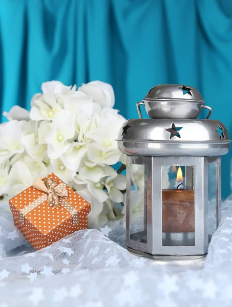 Decorative metallic lantern on fabric background — Stock Photo, Image