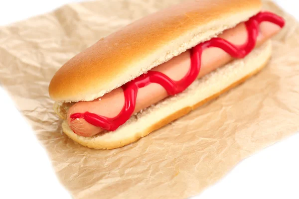 Tasty hot dog on paper — Stock Photo, Image