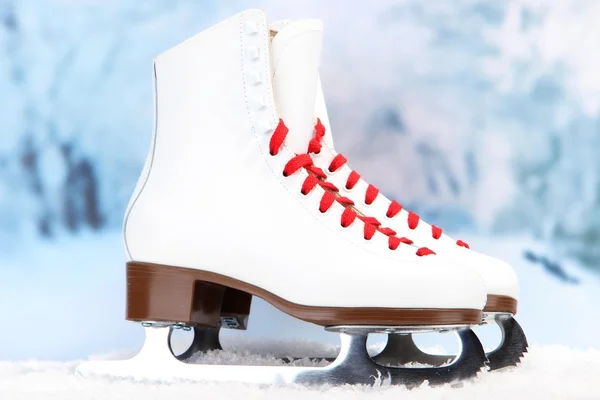 Figure skates on winter background — Stock Photo, Image