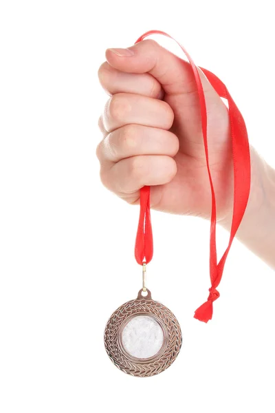 Silbermedaille in der Hand isoliert auf weiß — Stockfoto