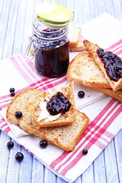 Delicious toast with jam on table close-up — Stock Photo, Image