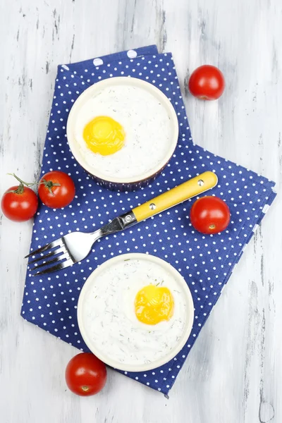 Baked eggs on table close up — Stock Photo, Image