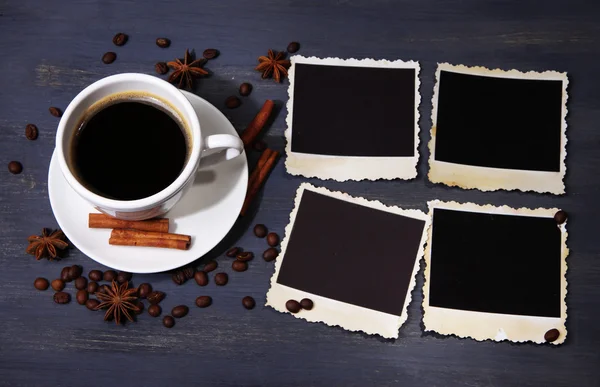 Coffee cup and old blank photos and spices, on wooden background — Stock Photo, Image