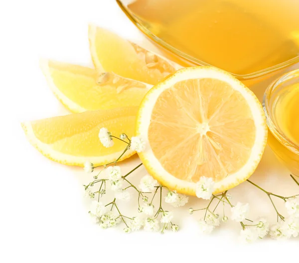 甜甜的蜂蜜，加上白色孤立的柠檬 — 图库照片