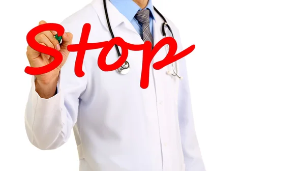 Doctor writing word Stop on transparent board — Stock Photo, Image