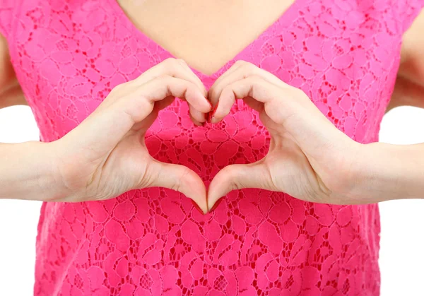 Mujer joven haciendo signo de corazón aislado en blanco — Foto de Stock