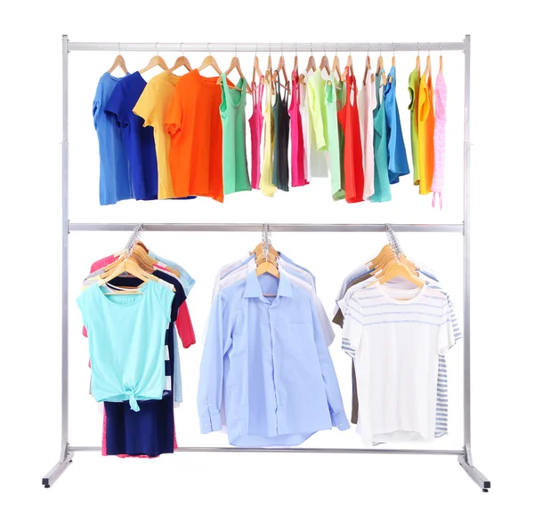 Verschillende kleding op hangers, op grijze achtergrond — Stockfoto