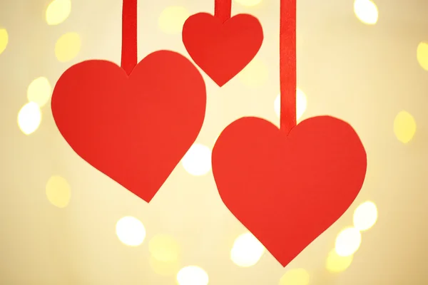 Paper hearts on bright background — Stock Photo, Image