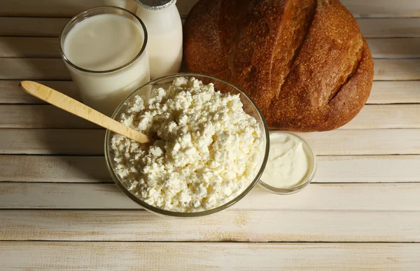 Tasty dairy products on wooden table — Stock Photo, Image