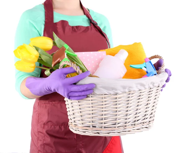 Housewife holding basket with cleaning equipment. Conceptual photo of spring cleaning. Isolated on white — Stock Photo, Image