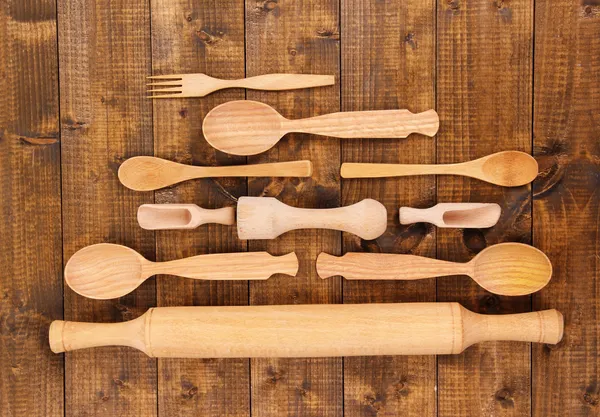 Wooden kitchen utensils on table close-up — Stock Photo, Image