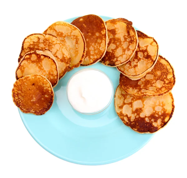 Fried pancakes on color plate, isolated on white — Stock Photo, Image