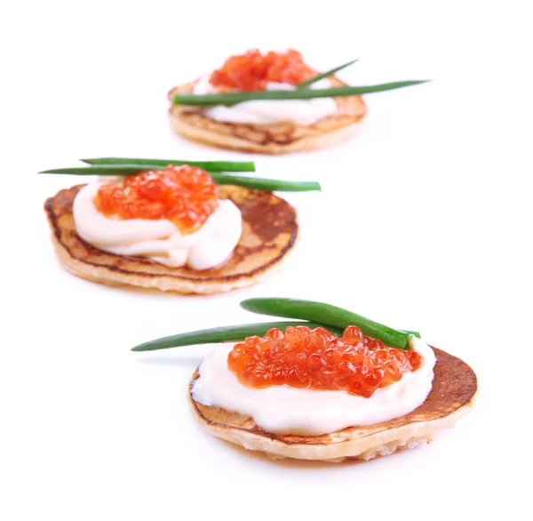 Pancakes with red caviar isolated on white — Stock Photo, Image