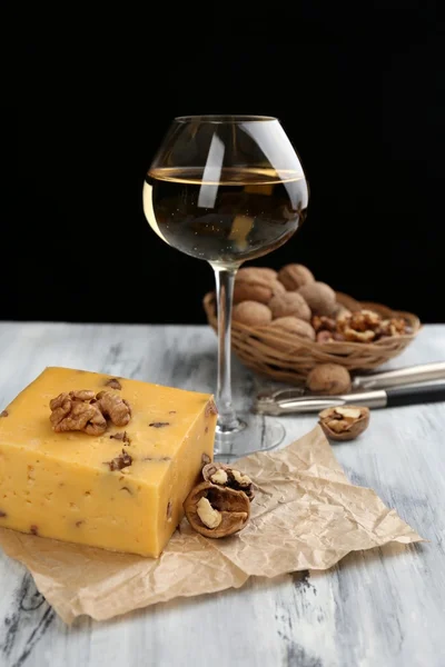Tasty Italian cheese and glass of vine on wooden table — Stock Photo, Image