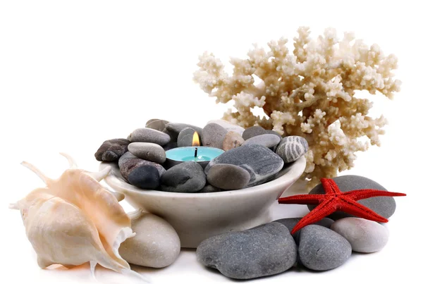 Composition with spa stones, candle, coral and star fish, isolated on white — Stock Photo, Image