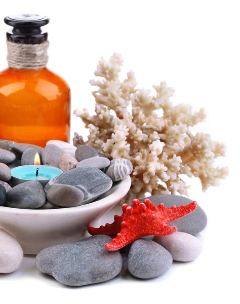 Composition with spa stones, candle, coral and star fish, isolated on white — Stock Photo, Image