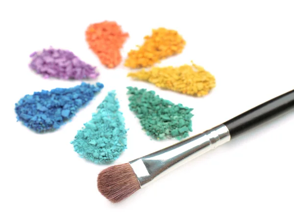 Rainbow crushed eyeshadow in shape of flower isolated on white — Stock Photo, Image