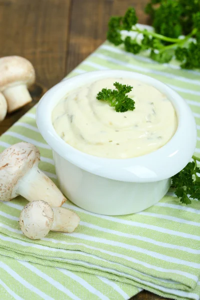 Delicate mushroom sauce in bowl on wooden table close-up — Stock Photo, Image