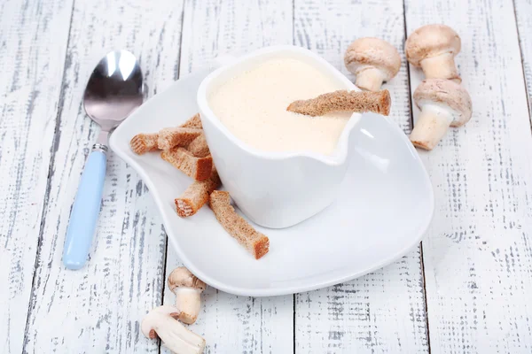 Delicate mushroom sauce in pitcher on wooden table close-up — Stock Photo, Image