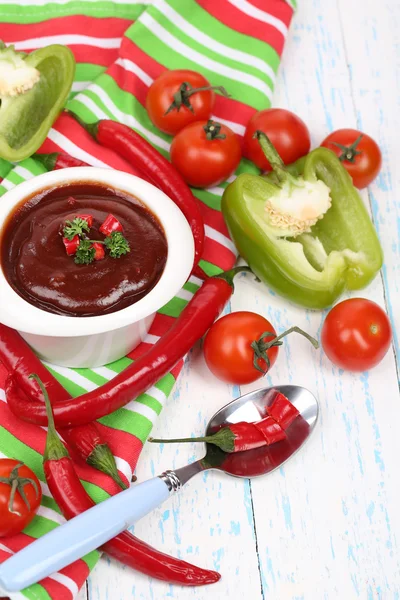 Tomato sauce in bowl on wooden table close-up — Stock Photo, Image