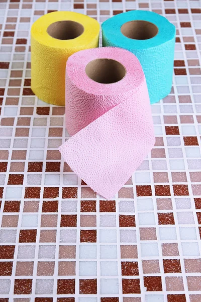 Color toilet paper rolls on bright background — Stock Photo, Image