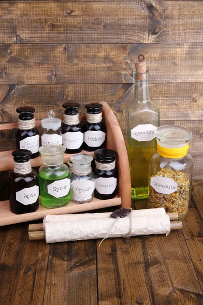 Historic old pharmacy bottles with label   on wooden background — Stock Photo, Image