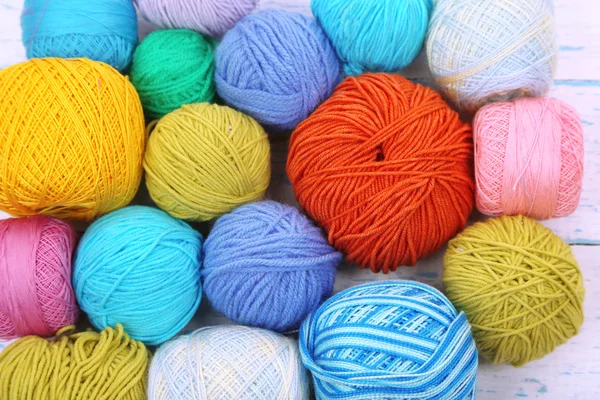 Yarns for knitting on wooden table close-up — Stock Photo, Image