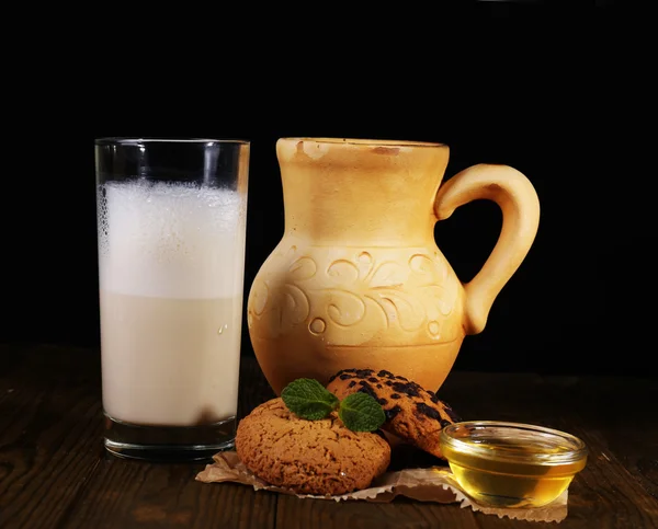 Eggnog with milk and eggs on table and black background — Stock Photo, Image