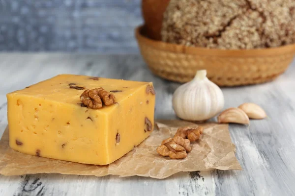 Tasty Italian cheese and bread on wooden table — Stock Photo, Image