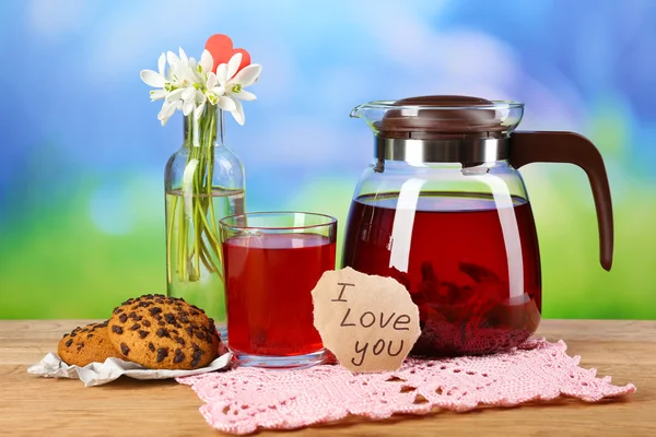 Tasty herbal tea and cookies on wooden table — Stock Photo, Image