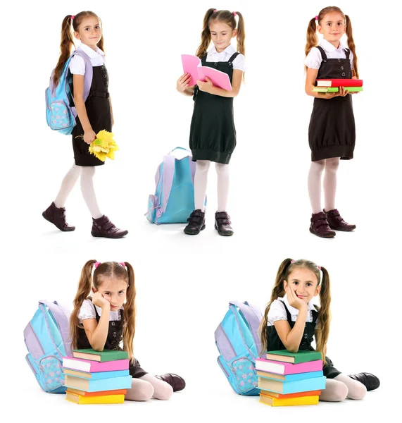 Menina bonito em uniforme escolar isolado em branco — Fotografia de Stock