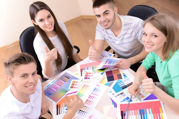 Business team working on their project together at office Stock Photo