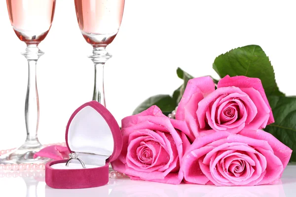 Composition with pink sparkle wine in glasses, and pink roses isolated on white — Stock Photo, Image