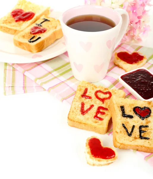 Delicious toast with jam and cup of tea on table close-up — Stock Photo, Image