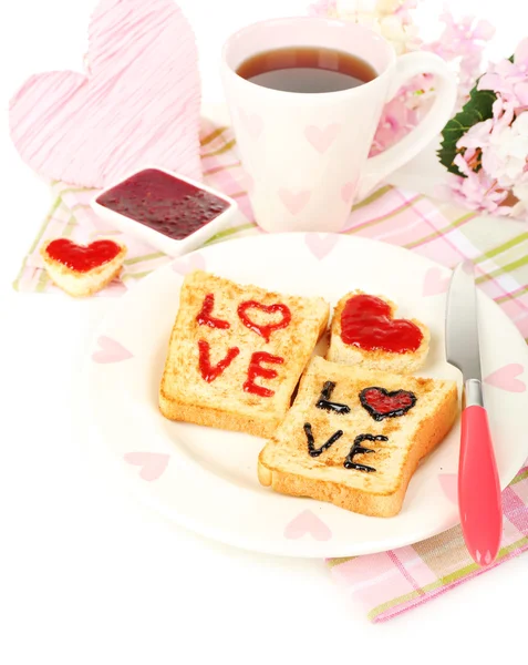 Delicious toast with jam and cup of tea on table close-up — Stock Photo, Image