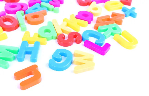 Lettres magnétiques colorées isolées sur blanc — Photo