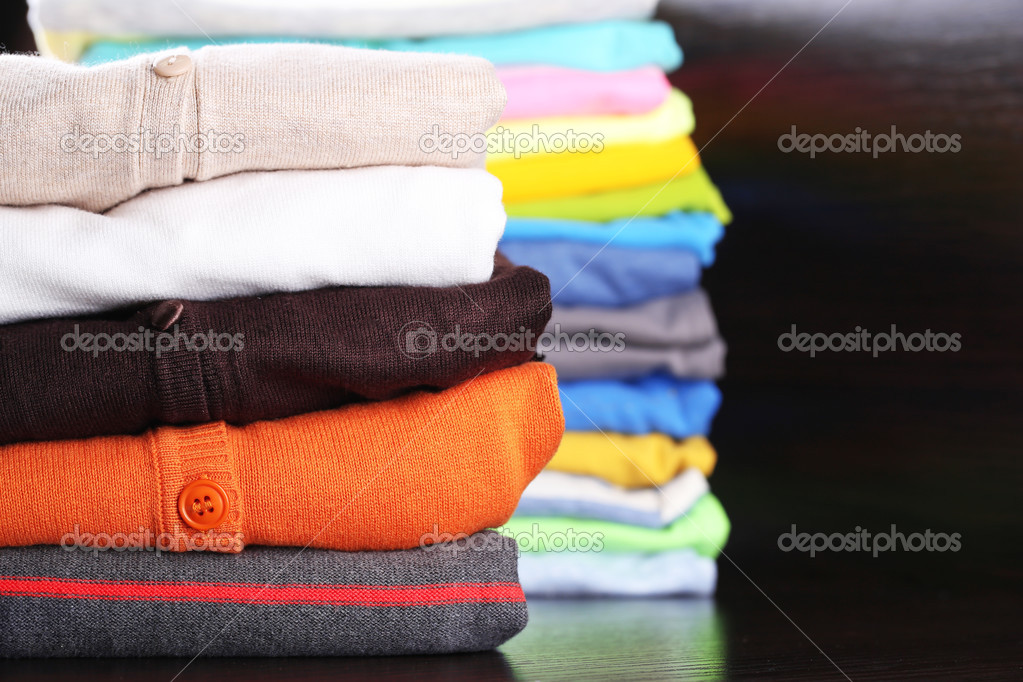 Stack of colorful clothes, on dark background