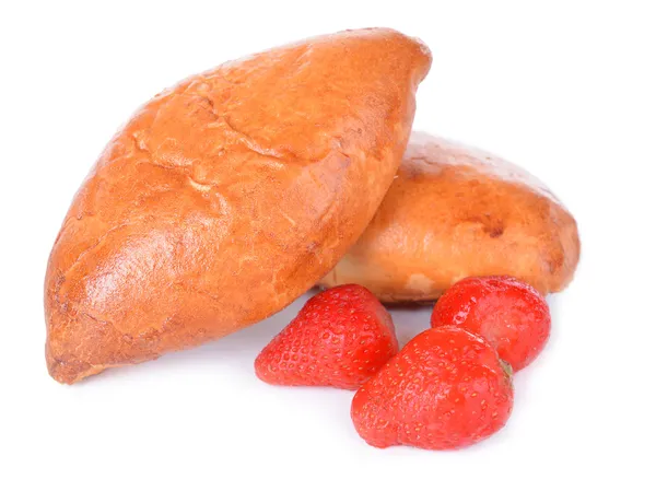 Fresh baked pasties with strawberries isolated on white — Stock Photo, Image