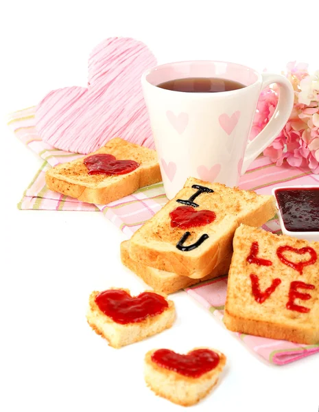 Delicioso brindis con mermelada y taza de té en primer plano de la mesa — Foto de Stock