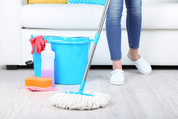 Cleaning floor in room close-up