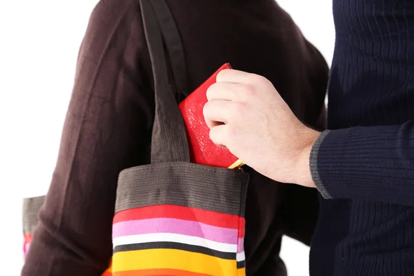 El carterista está robando la cartera de la bolsa, de cerca, aislado en blanco — Foto de Stock